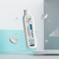 SlipNix anti slip gel bottle with floating marble pieces and water drops on a modern background